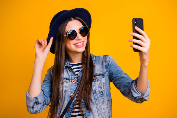 Close-up portrait of her she nice-looking charming attractive lovely winsome fascinating cheerful cheery straight-haired lady making taking selfie isolated over bright vivid shine yellow background - Foto, Imagen