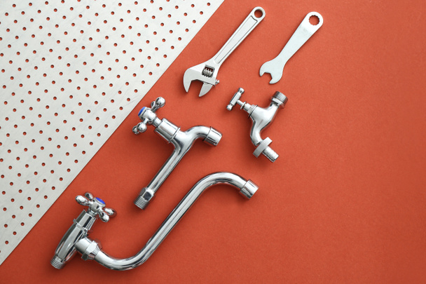 Set of plumbing tools and items on color background - Φωτογραφία, εικόνα