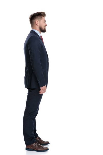 Side view of a confident businessman standing - Zdjęcie, obraz