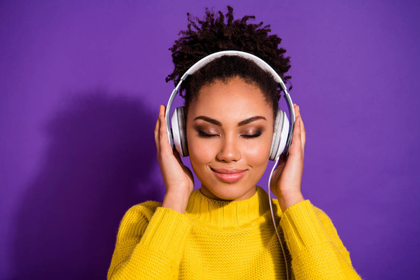 Close-up portrait of her she nice attractive lovely dreamy glamorous cheerful peaceful calm wavy-haired lady listening new hit isolated over bright vivid shine violet background - Zdjęcie, obraz
