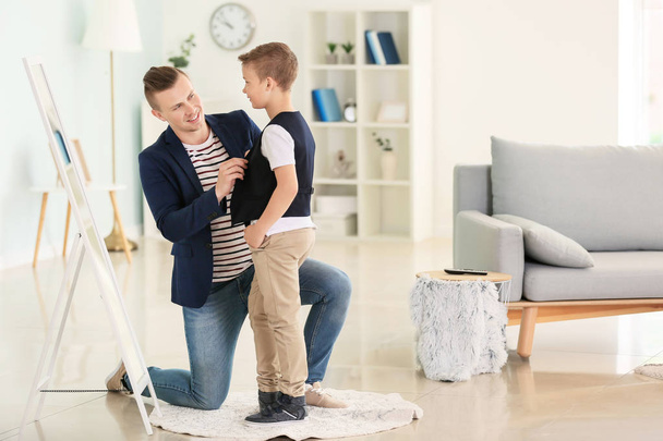 Father and son in fashionable clothes at home - Photo, Image