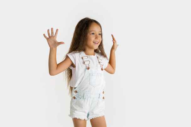 Portrait of little girl isolated on white studio background - Foto, imagen