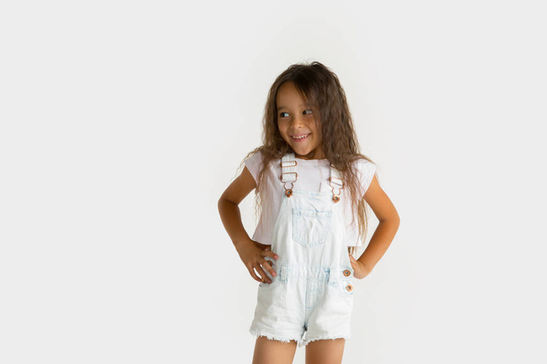 Portrait of little girl isolated on white studio background - 写真・画像