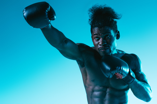 shirtless african american sportsman with muscular torso on blue background - Fotoğraf, Görsel