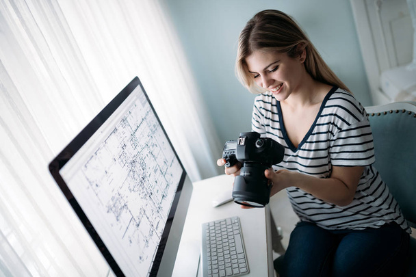 Young attractive designer working on project at home - Foto, Bild