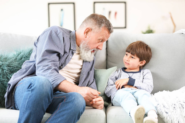 Cute little boy with grandfather at home - Fotoğraf, Görsel