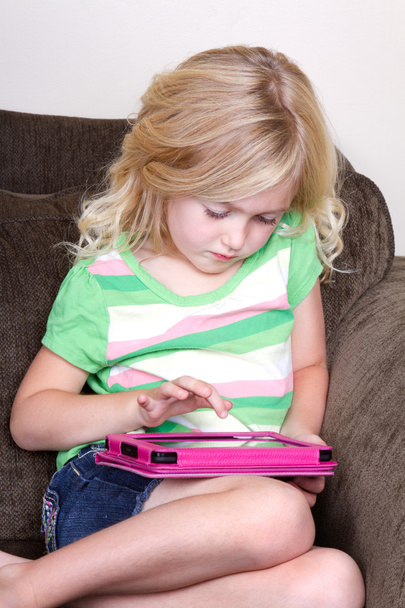 child or preschooler using a tablet - Фото, изображение