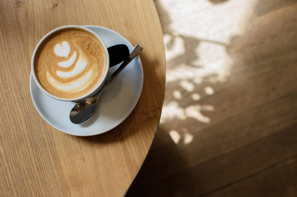 A cup of cappuccino. - Foto, Bild