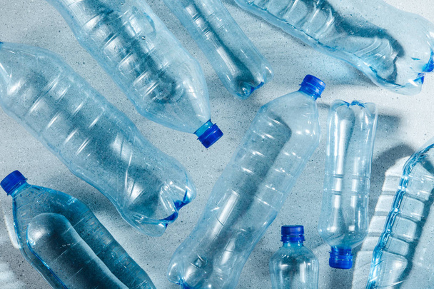 Blue single use plastic bottles, concept of recycling plastic and ecology - Фото, зображення