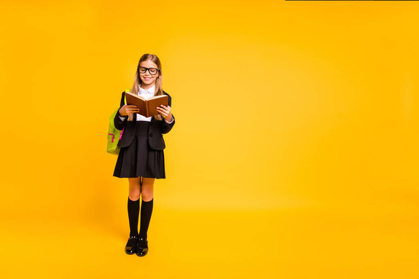 Full body photo of stylish kid hold hand literature story look have eyewear eyeglasses bag backpack rucksack standing isolated over yellow background - Φωτογραφία, εικόνα