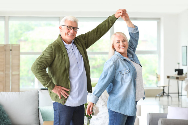Portrait of happy mature couple dancing at home - Fotoğraf, Görsel