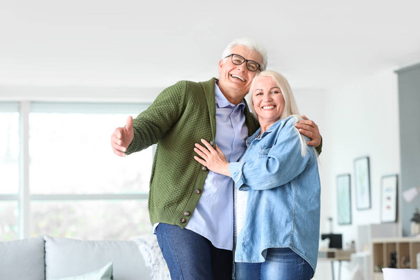 Portrait of happy mature couple at home - Photo, Image