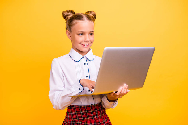 Portrait of her she nice lovely attractive cheerful cheery intelligent pre-teen girl browsing web library knowledge isolated over bright vivid shine yellow background - Zdjęcie, obraz