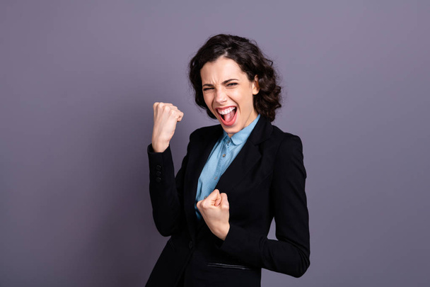 Portrait of ecstatic lady youth shout yeah dressed black blazer classy outfit wavy curly goal celebration isolated grey background - Foto, immagini