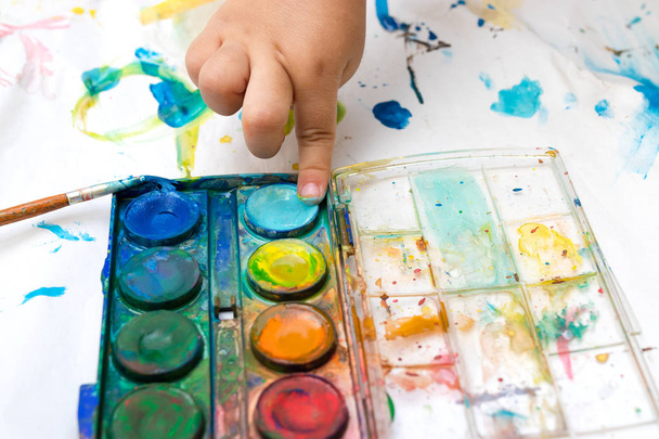 Child paint with watercolors. Education concept. - Photo, Image