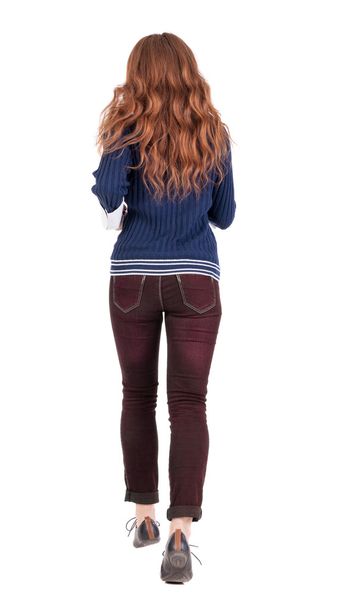 back view of jumping woman in jeans. - Foto, Imagem