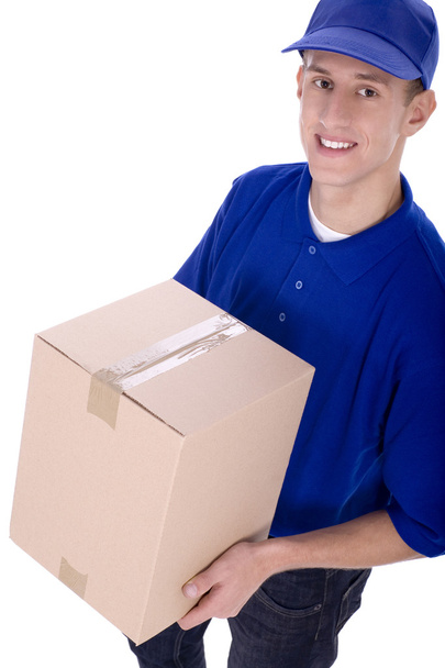 Delivery man carrying cardboard box - Fotoğraf, Görsel