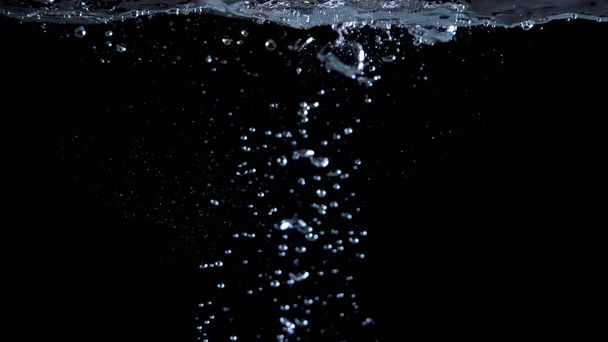 きらめく水の液体泡が飛び散るぼやけた画像 - 写真・画像