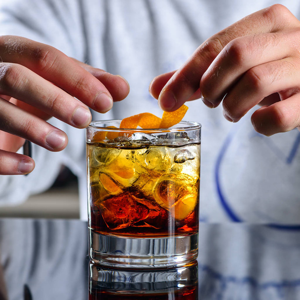 bartender prepares a classic Negroni cocktail - Photo, Image