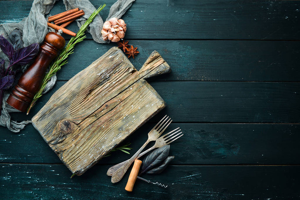 The background of cooking. On a black wooden background. Top view. Free space for your text. - 写真・画像