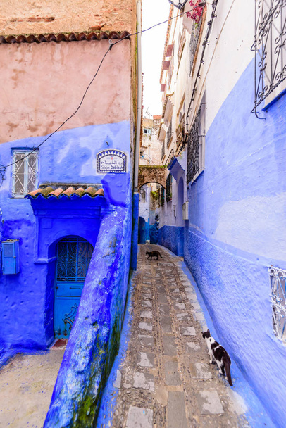 Chefchaouen, Morocco - December 13, 2018: Sightseeing of Morocco. Beautiful blue medina of Chefchaouen town. Traditional blue street - Фото, изображение