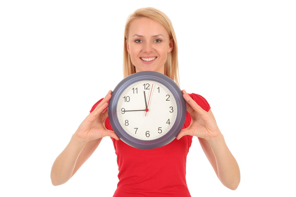 Woman holding clock - Foto, imagen