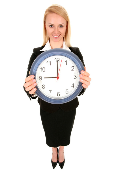 Businesswoman holding clock - Foto, imagen