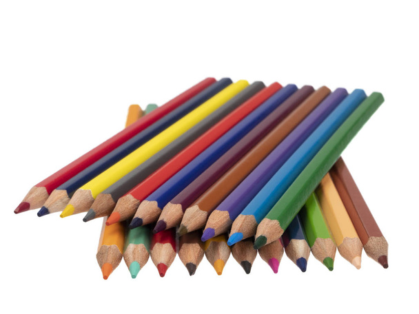 2つの層の対角線上に色鉛筆を横たわっています。白い背景に静物だクローズ アップ. - 写真・画像
