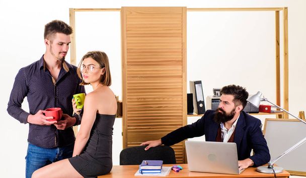 Flirting with coworker coffee break. Woman flirting with coworker. Woman attractive working male colleagues. Office romance concept. Strict boss. She distracts workers. Flirting and seduction - Photo, image