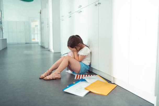 Little girl crying after awful first day at school with mockery - Photo, image