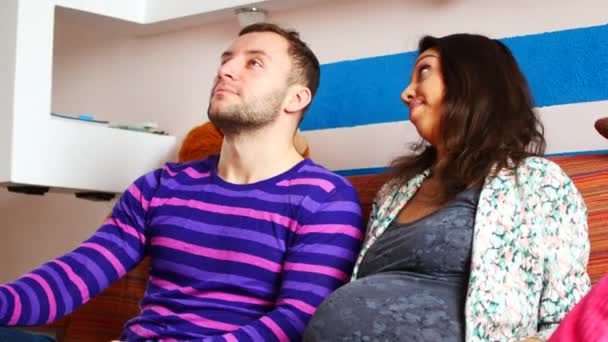 Couple With Pregnant Woman Relaxing On Sofa - Πλάνα, βίντεο
