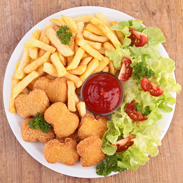 Chicken nuggets,french fries and salad - Foto, immagini