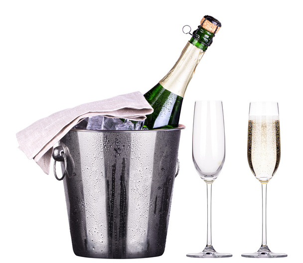 Glass and bottle of champagne in ice bucket - Foto, Bild