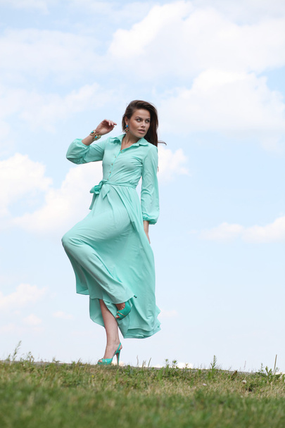 Attractive young woman in green dress - Foto, Imagem
