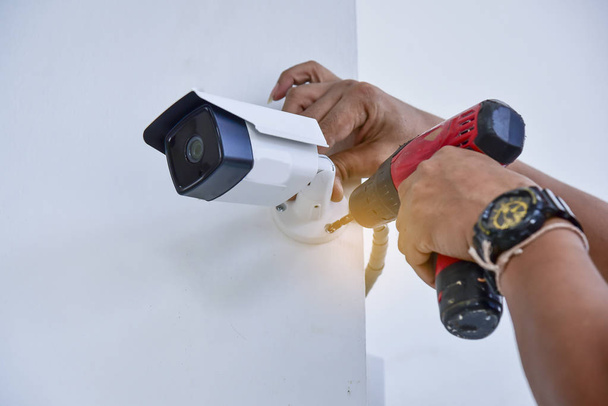 Technician installation wireless CCTV  infrared camera technology 4.0 for security area. - Φωτογραφία, εικόνα