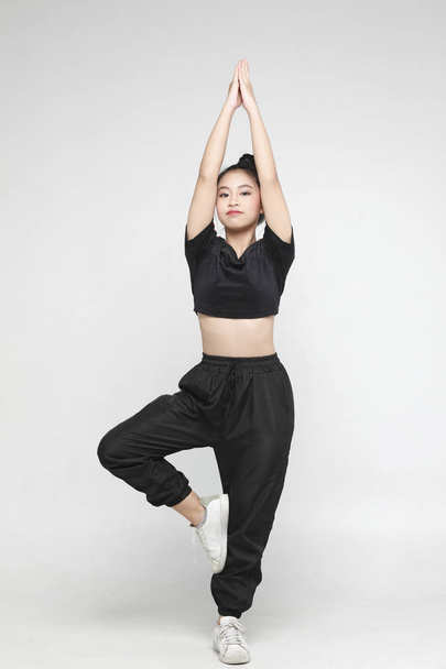 teenagers asian girl in sportswear and yoga style on white background. - Photo, Image