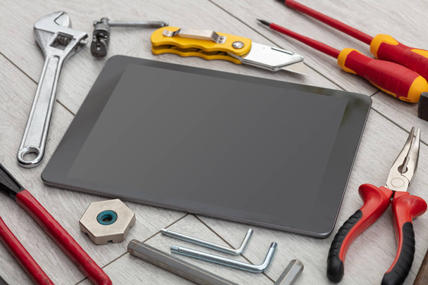 Household tools and tablet with empty screen - Valokuva, kuva