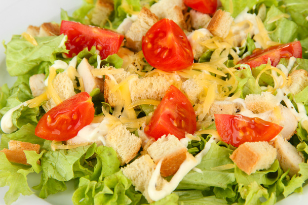 Caesar salad on white plate, close up - Фото, зображення