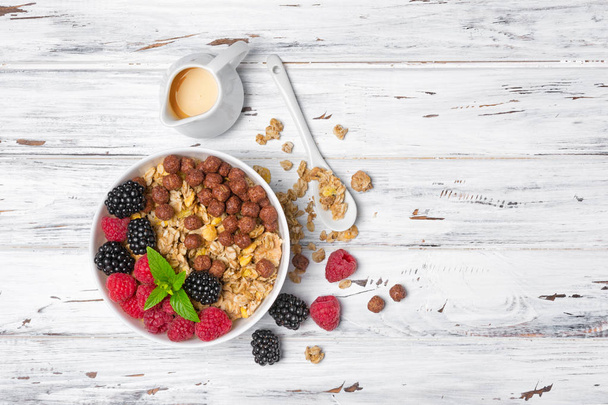 Healthy breakfast - oatmeal with fresh berries and homemade yogurt - Photo, Image
