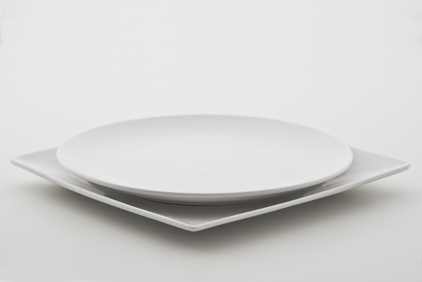 Porcelain plate on white background - Fotoğraf, Görsel