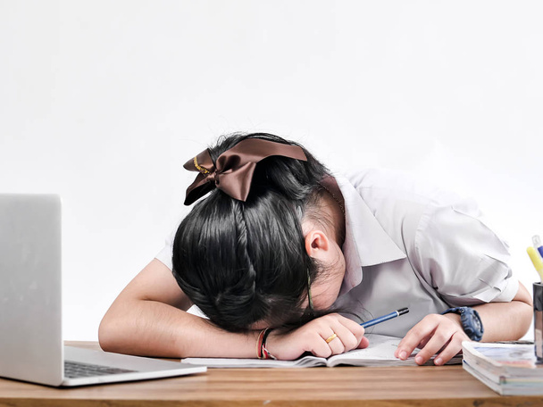 very tired/exhausted, pretty, female student with books working  - Zdjęcie, obraz