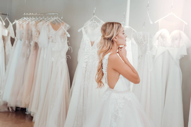 Young bride thinking about her wedding look. - Foto, imagen