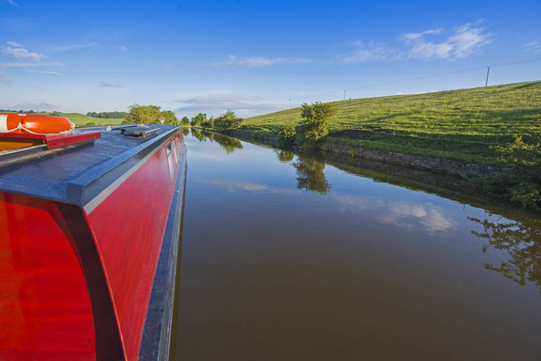 Narrowboat on a British canal in rural setting - Photo, Image