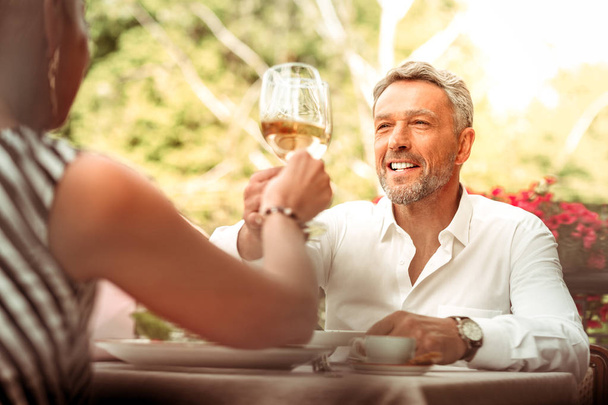 Successful businessman feeling relieved having romantic date with wife - Фото, зображення