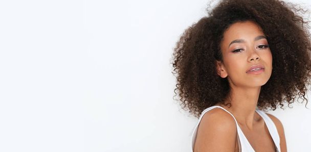 Natural afro -amercian beauty in basic white clothes.  - Photo, Image