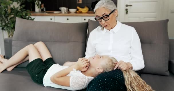 Grandmother Relaxing with Granddaughter - Кадры, видео
