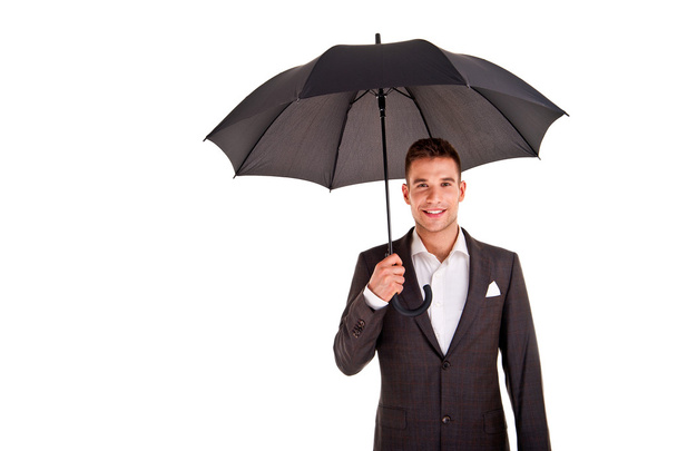 Full length portrait of businessman with opened umbrella - Foto, afbeelding