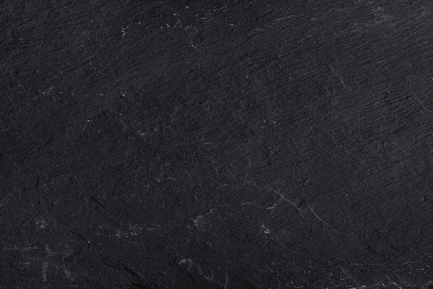Sötét szürke fekete pala háttér vagy textúra természetes kő. - Fotó, kép