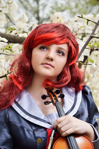 Jeune fille rêveuse avec un violon
 - Photo, image