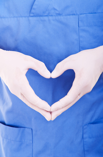 cardiologista em luvas azuis tomar coração
 - Foto, Imagem